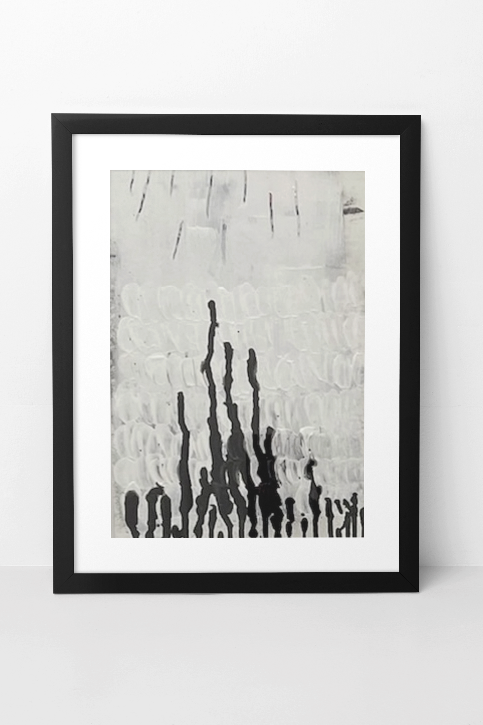 Framed abstract art print with black and white brush strokes on a white background